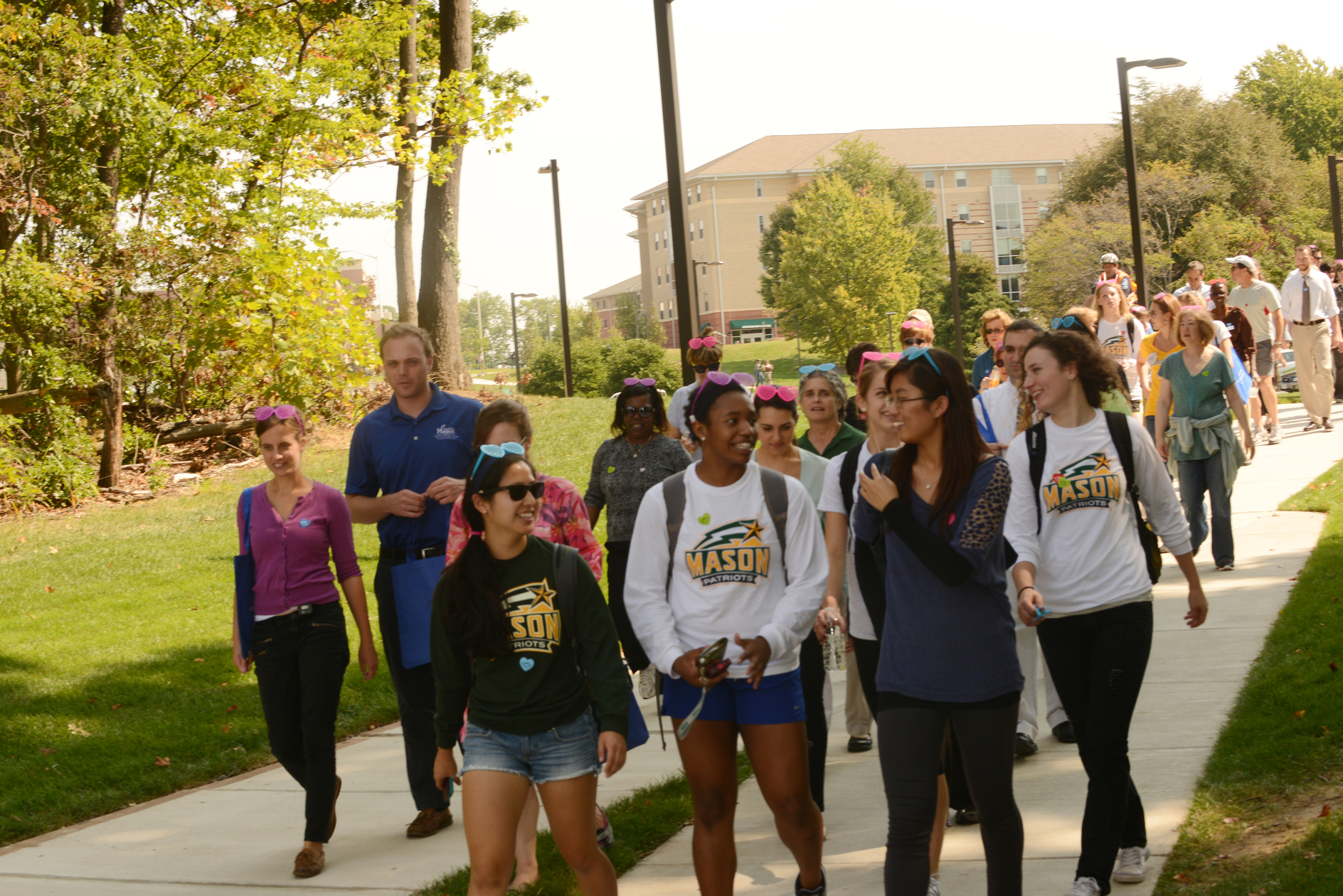 Students, faculty, and staff participate in the 4th annual Happy Heart Walk. The event sponsored by Wellness at Mason promotes preventive health screenings tand encourages healthy choices in general wellness and exercise. Photo by Evan Cantwell/Creative Services/George Mason University